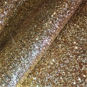 The Chunky Glitter fabric collection is ideal for adding a touch of sparkle to your projects such as shoes, handbags, hats, bows, garments, belts, and accessories. The material is made of Glitter Fabric PET in round and hexagon shapes with a polyester twill fabric backing. It has a width of 54 inches with a tolerance of ± 0.5" and a thickness of 1.3mm (0.05"). The country of origin is China.