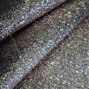 The Chunky Hologram Glitter fabric collection is made of Glitter Fabric PET in round and hexagon shapes with a polyester twill fabric backing. It is 54 inches wide with a tolerance of ± 0.5″ and has a thickness of 1.3mm (0.05″). This collection can be used for shoes, handbags, hats, bows, garments, belts, and accessories.