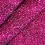The Chunky Glitter fabric collection is ideal for adding a touch of sparkle to your projects such as shoes, handbags, hats, bows, garments, belts, and accessories. The material is made of Glitter Fabric PET in round and hexagon shapes with a polyester twill fabric backing. It has a width of 54 inches with a tolerance of ± 0.5" and a thickness of 1.3mm (0.05"). The country of origin is China.