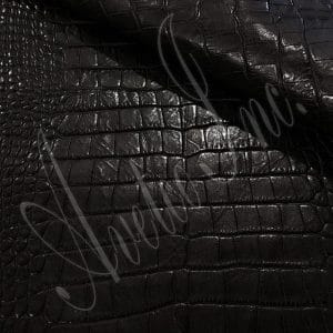 The Alligator leather is a highly attractive and unique type of leather that boasts an exotic style and color tone that is truly mesmerizing. It is a corrected grain leather that is sourced from Europe and has been specially embossed to reproduce the pattern of alligator skin, which gives it a very prominent appearance. The leather's deep texture and rich tone variation are completed by a stucco-finish on the surface, which gives it a smooth surface with a subtle shine.