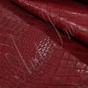 The Alligator leather is a highly attractive and unique type of leather that boasts an exotic style and color tone that is truly mesmerizing. It is a corrected grain leather that is sourced from Europe and has been specially embossed to reproduce the pattern of alligator skin, which gives it a very prominent appearance. The leather's deep texture and rich tone variation are completed by a stucco-finish on the surface, which gives it a smooth surface with a subtle shine.
