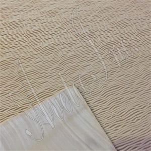 Close-up of wave tread design on natural gum rubber soling sheet for shoes
