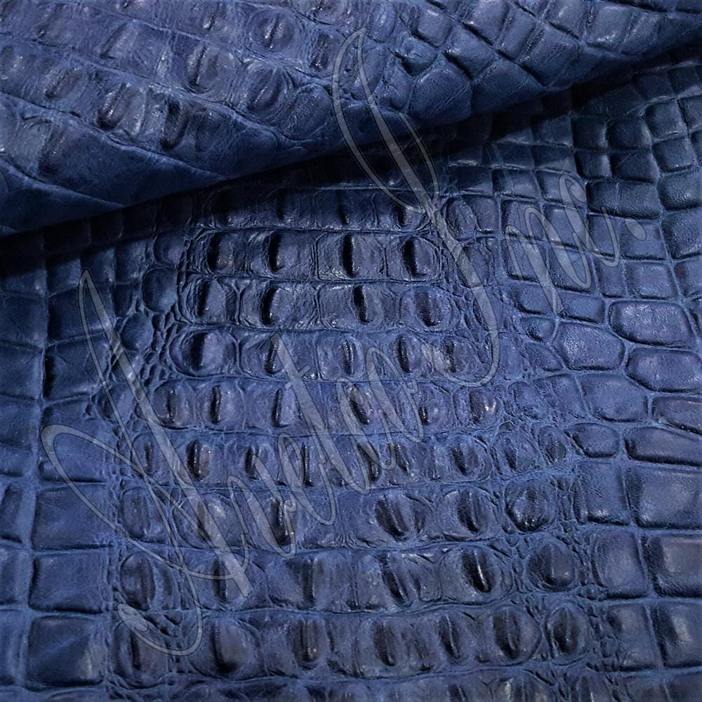 Dazzling Blue Oltu Crocodile Embossed Cow Leather Avetco Inc