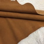 brown suede goat leather avetcoinc@ | Avetco Leather Hides and Eva Foam Our Kidskin Suede Leather collection features a beautiful, ultra-soft suede material that creates a chic, timeless look for any style. The collection includes a curated selection of neutral tones, offering classic shades that blend seamlessly into any wardrobe. The luxurious suede material has a supple feel that is irresistible to the touch, perfect for those seeking elegance in understated colors.