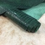 The Alligator Embossed Cow leather is a highly attractive and unique type of leather that boasts an exotic style and color tone that is truly mesmerizing. It is a corrected grain leather that is sourced from Europe and has been specially embossed to reproduce the pattern of alligator skin, which gives it a very prominent appearance. The leather's deep texture and rich tone variation are completed by a stucco finish on the surface, which gives it a smooth surface with a subtle shine.