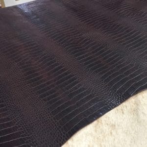 The Alligator leather is a highly attractive and unique type of leather that boasts an exotic style and color tone that is truly mesmerizing. It is a corrected grain leather that is sourced from Europe and has been specially embossed to reproduce the pattern of alligator skin, which gives it a very prominent appearance. The leather's deep texture and rich tone variation are completed by a stucco-finish on the surface, which gives it a smooth surface with a subtle shine.
