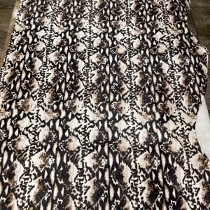 Cowhide – Anaconda Print (Hair-On Hide) Bring an exotic edge to your next project with this striking Anaconda print on natural hair-on cowhide. Featuring bold black and tan tones, this unique pattern is perfect for handbags, footwear, garments, upholstery, pillows, and custom décor. Chrome tanned for softness and durability, each hide delivers a luxurious, high-fashion look with a wild twist.