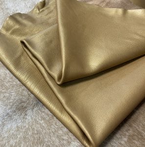 The Hudson Metallic Collection - a unique style that boasts a distressed look and pearlized finish. The leather has a smooth and silky surface, showcasing an array of vibrant colors that shimmer in the light. This collection features natural drum-dyed leather that is full grain and made from full-hide cowhide. With an average hide size of 18-20 square feet, the leather is 3 ounces thick (1.0 - 1.2mm) with a pearlized natural grain texture. The temper is medium-soft, and the tannage is chrome-tanned.