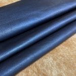 The Hudson Metallic Collection - a unique style that boasts a distressed look and pearlized finish. The leather has a smooth and silky surface, showcasing an array of vibrant colors that shimmer in the light. This collection features natural drum-dyed leather that is full grain and made from full-hide cowhide. With an average hide size of 18-20 square feet, the leather is 3 ounces thick (1.0 - 1.2mm) with a pearlized natural grain texture. The temper is medium-soft, and the tannage is chrome-tanned.