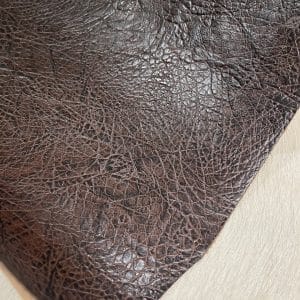 Crafted from premium cowhide, this double shoulder leather features an intricate elephant embossing pattern that adds a bold, exotic texture to any project
