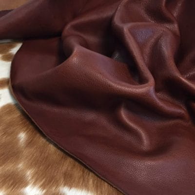 Introducing the Terrace collection VEG Tanned Leather, made from high-quality cowhide with a drum-dyed finish. This versatile style offers a smooth and consistent color that adds elegance and simplicity to any look. The surface of the leather features unique grooves and divots due to the whole-grain hide and its vegetal tannage.