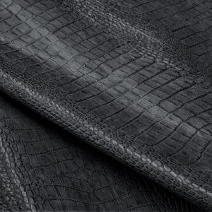 The Alligator leather is a highly attractive and unique type of leather that boasts an exotic style and color tone that is truly mesmerizing. It is a corrected grain leather that is sourced from Europe and has been specially embossed to reproduce the pattern of alligator skin, which gives it a very prominent appearance. The leather's deep texture and rich tone variation are completed by a stucco-finish on the surface, which gives it a smooth surface with a subtle shine.