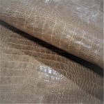 The Alligator leather is a highly attractive and unique type of leather that boasts an exotic style and color tone that is truly mesmerizing. It is a corrected grain leather that is sourced from Europe and has been specially embossed to reproduce the pattern of alligator skin, which gives it a very prominent appearance. The leather's deep texture and rich tone variation are completed by a stucco-finish on the surface, which gives it a smooth surface with a subtle shine.