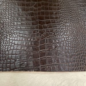 Crocodile Embossed Cow Double Shoulder, crafted from premium vegetable-tanned cowhide. Each hide is expertly embossed with a deep, realistic crocodile texture, giving you the exotic aesthetic without the exotic price tag. At just 3 oz (1.2–1.4 mm) thick, this leather is pliable yet strong—perfect for crafting luxury bags, wallets, belts, footwear, and costume design.