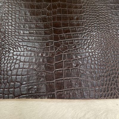 Crocodile Embossed Cow Double Shoulder, crafted from premium vegetable-tanned cowhide. Each hide is expertly embossed with a deep, realistic crocodile texture, giving you the exotic aesthetic without the exotic price tag. At just 3 oz (1.2–1.4 mm) thick, this leather is pliable yet strong—perfect for crafting luxury bags, wallets, belts, footwear, and costume design.