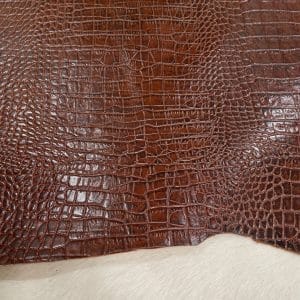 Crocodile Embossed Cow Double Shoulder, crafted from premium vegetable-tanned cowhide. Each hide is expertly embossed with a deep, realistic crocodile texture, giving you the exotic aesthetic without the exotic price tag. At just 3 oz (1.2–1.4 mm) thick, this leather is pliable yet strong—perfect for crafting luxury bags, wallets, belts, footwear, and costume design.
