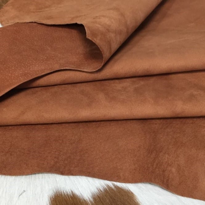 What is nubuck leather This material is suitable for footwear, accessories, handbags, apparel, craft, belts, and DIY projects. Nubuck leather is swine (pig leather) that has a medium soft temper and a chrome tannage. It has a texture that is referred to as nubuck and an average hide size of 8-10 sq. ft. The thickness is 3 oz. (1.0 – 1.2 mm). The raw material comes from the subspecies Sus scrofa domesticus and is from Taiwan. It can be used for DIY projects.
