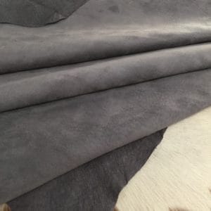 What is nubuck leather This material is suitable for footwear, accessories, handbags, apparel, craft, belts, and DIY projects. Nubuck leather is swine (pig leather) that has a medium soft temper and a chrome tannage. It has a texture that is referred to as nubuck and an average hide size of 8-10 sq. ft. The thickness is 3 oz. (1.0 – 1.2 mm). The raw material comes from the subspecies Sus scrofa domesticus and is from Taiwan. It can be used for DIY projects.