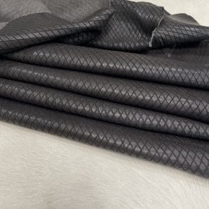 Premium grain leather with a laser-cut diamond pattern, designed for both elegance and durability. This leather features a wax finish, enhancing its texture and depth, making it an excellent choice for upholstery, accessories, footwear, and high-end fashion applications.