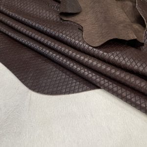 Premium grain leather with a laser-cut diamond pattern, designed for both elegance and durability. This leather features a wax finish, enhancing its texture and depth, making it an excellent choice for upholstery, accessories, footwear, and high-end fashion applications.