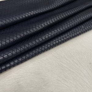 Premium grain leather with a laser-cut diamond pattern, designed for both elegance and durability. This leather features a wax finish, enhancing its texture and depth, making it an excellent choice for upholstery, accessories, footwear, and high-end fashion applications.