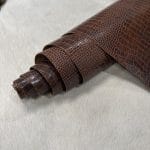 The Alligator leather is a highly attractive and unique type of leather that boasts an exotic style and color tone that is truly mesmerizing. It is a corrected grain leather that is sourced from Europe and has been specially embossed to reproduce the pattern of alligator skin, which gives it a very prominent appearance. The leather's deep texture and rich tone variation are completed by a stucco-finish on the surface, which gives it a smooth surface with a subtle shine.