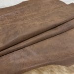 The Y. Bolt Cow Suede Collection is a range of leather products that have a unique and rustic appearance due to a combination of special waxes applied on the surface. The leather is tanned using a specific process that involves hot wax application, resulting in a vintage and hip look. The Bolt collection has a subtly shiny and rigid texture that provides a consistent color and design across the surface, making it a durable and attractive leather option for footwear, accessories, handbags, wallets, belts, and more. The raw material used for this collection is cowhide, and the leather is made of cow suede and wax. It has a semi-soft leather temper and a thickness of 1.4-1.6mm, with a weight of 3/4 oz. The average hide size is 17-19 sq. ft., and the tanning process used is chrome tanning. The leather is sourced from Turkey, and it is free of PCP, Azo Pigments, Chrome VI, Formaldehyde, and APEO, ensuring a safe and high-quality product.