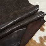The Y. Bolt Cow Suede Collection is a range of leather products that have a unique and rustic appearance due to a combination of special waxes applied on the surface. The leather is tanned using a specific process that involves hot wax application, resulting in a vintage and hip look. The Bolt collection has a subtly shiny and rigid texture that provides a consistent color and design across the surface, making it a durable and attractive leather option for footwear, accessories, handbags, wallets, belts, and more. The raw material used for this collection is cowhide, and the leather is made of cow suede and wax. It has a semi-soft leather temper and a thickness of 1.4-1.6mm, with a weight of 3/4 oz. The average hide size is 17-19 sq. ft., and the tanning process used is chrome tanning. The leather is sourced from Turkey, and it is free of PCP, Azo Pigments, Chrome VI, Formaldehyde, and APEO, ensuring a safe and high-quality product.