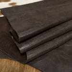 The Y. Bolt Cow Suede Collection is a range of leather products that have a unique and rustic appearance due to a combination of special waxes applied on the surface. The leather is tanned using a specific process that involves hot wax application, resulting in a vintage and hip look. The Bolt collection has a subtly shiny and rigid texture that provides a consistent color and design across the surface, making it a durable and attractive leather option for footwear, accessories, handbags, wallets, belts, and more. The raw material used for this collection is cowhide, and the leather is made of cow suede and wax. It has a semi-soft leather temper and a thickness of 1.4-1.6mm, with a weight of 3/4 oz. The average hide size is 17-19 sq. ft., and the tanning process used is chrome tanning. The leather is sourced from Turkey, and it is free of PCP, Azo Pigments, Chrome VI, Formaldehyde, and APEO, ensuring a safe and high-quality product.