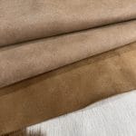 The Jelly Satin Suede Collection features high-quality leather products made from European cowhide treated with a glittery surface. The leather has a smooth suede texture in one direction and a coarser texture in the other, perfect for creating unique textures. Its shimmery yet subtle exterior creates a modern and chic look, ideal for footwear, garments, accessories, and more. The collection is made in Turkey using chrome tanning, which requires fewer chemicals and produces a more consistent color. It's free of harmful chemicals like PCP, Azo Pigments, Chrome VI, Formaldehyde, and APEO. This collection is perfect for those who value quality, style, and durability.