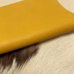 The Milano Cow Leather Collection is made of full-grain European leather produced from whole hides. This gives the leather a soft and luxurious finish on the surface, resulting in a subtle yet rich appearance. The collection is available in 48 complementary colors and is lightly pigmented and flexible, making it an excellent option for cutting. The Milano Collection is unbuffed and chrome-tanned, giving these leathers a smooth and elegant look.