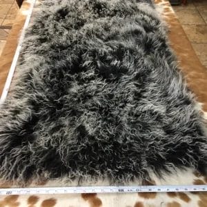 Our Mongolian Tibetan lamb fur plates, handpicked by expert craftsmen, offer superior quality. Each skin is made of the finest silky, long, and ultra-soft wool, ensuring it meets your standards. These plates are perfect for adding a touch of luxury to your home decor. You can use them to upholster furniture such as sofas, chairs, ottomans, benches, etc. They are also widely used in the fashion industry to create scarves, boas, tote bags, garments, and accessories. These 2ft x 4ft plates made with 4-5 inch long curly soft wool offer both style and comfort, making them an excellent choice for home decor or fashion.