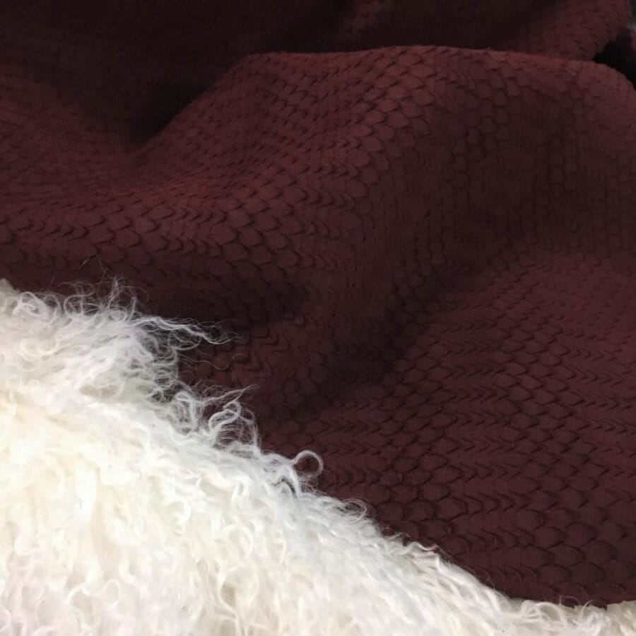 Oxblood red Tirtil Collection embossed nubuck cow leather side with scale-like perforated texture – Avetco