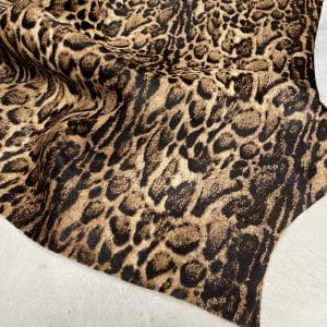 This beige cowhide with panther print adds a fierce, fashion-forward edge to any design. With bold black markings over soft beige tones, it's ideal for handbags, shoes, garments, furniture, pillows, and interior décor. Printed on premium hair-on cowhide and chrome tanned for durability and softness. Each hide is unique, perfect for custom statement pieces.