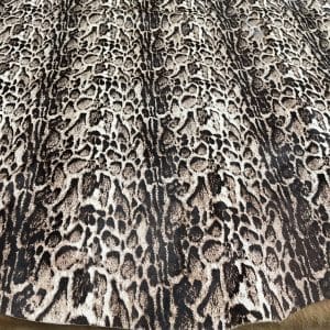 This beige cowhide with panther print adds a fierce, fashion-forward edge to any design. With bold black markings over soft beige tones, it's ideal for handbags, shoes, garments, furniture, pillows, and interior décor. Printed on premium hair-on cowhide and chrome tanned for durability and softness. Each hide is unique, perfect for custom statement pieces.
