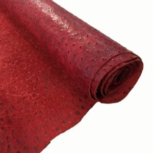 Ostrich Embossed Cow Leather is made of European leather with a unique embossed grain texture that resembles Ostrich skin. Its rough appearance, complete with grooves and bumps, makes it beautiful and durable. The leather has a waxed finish that adds smoothness and shine to its surface. This collection uses chrome tanning, which gives it a luxurious and rich look.