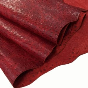 Ostrich Embossed Cow Leather is made of European leather with a unique embossed grain texture that resembles Ostrich skin. Its rough appearance, complete with grooves and bumps, makes it beautiful and durable. The leather has a waxed finish that adds smoothness and shine to its surface. This collection uses chrome tanning, which gives it a luxurious and rich look.