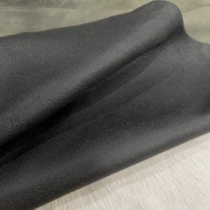 The Lambskin Crackle" is a collection of finely crafted pieces made from the finest lambskin leather. Each piece is designed to showcase unparalleled softness and elegance. The meticulous tanning process involves delicately applying wax to the surface, which creates a captivating crackle effect. This adds depth and character to the leather. The matte finish and rich olive night color further enhance its allure, providing a visually and tactilely stunning experience. The collection offers a versatile range of possibilities for those who appreciate the finer things in life. It's perfect for elevating your wardrobe with statement apparel, accessorizing with chic handbags, stepping out in style with sophisticated shoes, or indulging in artisanal leather crafting.