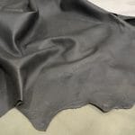 The Lambskin Crackle" is a collection of finely crafted pieces made from the finest lambskin leather. Each piece is designed to showcase unparalleled softness and elegance. The meticulous tanning process involves delicately applying wax to the surface, which creates a captivating crackle effect. This adds depth and character to the leather. The matte finish and rich olive night color further enhance its allure, providing a visually and tactilely stunning experience. The collection offers a versatile range of possibilities for those who appreciate the finer things in life. It's perfect for elevating your wardrobe with statement apparel, accessorizing with chic handbags, stepping out in style with sophisticated shoes, or indulging in artisanal leather crafting.