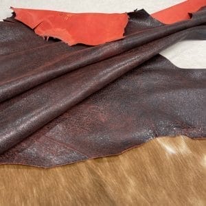 Indulge in luxury with our Lambskin Crackle Collection. Made of premium lambskin leather, each piece has a captivating crackle effect created by delicate waxing. With a matte finish and vibrant colors, the collection offers versatile possibilities. Elevate your wardrobe with statement apparel, chic handbags, sophisticated shoes or artisanal leather crafting. Experience timeless elegance and impeccable quality with our Lambskin Crackle Collection.