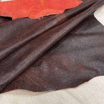 SL-106RED Crackle Lambskin 3 | Avetco Leather Hides and Eva Foam Indulge in luxury with our Lambskin Crackle Collection. Made of premium lambskin leather, each piece has a captivating crackle effect created by delicate waxing. With a matte finish and vibrant colors, the collection offers versatile possibilities. Elevate your wardrobe with statement apparel, chic handbags, sophisticated shoes or artisanal leather crafting. Experience timeless elegance and impeccable quality with our Lambskin Crackle Collection.