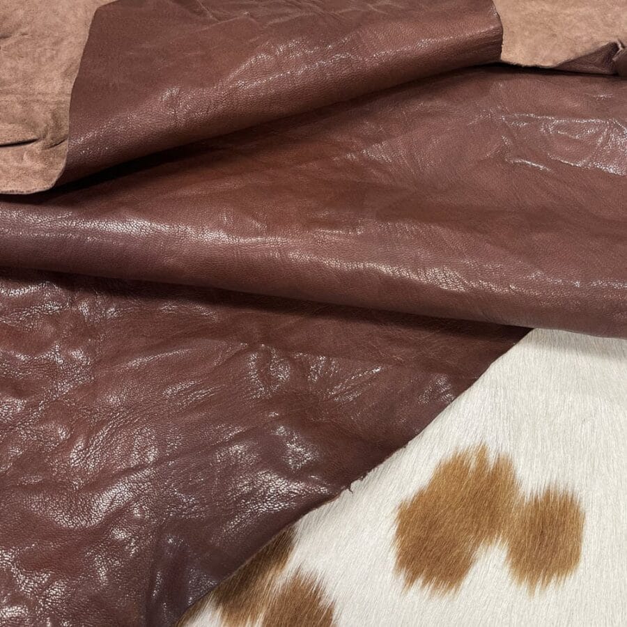 The Goatskin-washed Leather Collection offers an exclusive range of leather that undergoes a special tanning process, resulting in a unique and irregular texture. The leather's shrunken grain creates a striking and dynamic appearance, while its distressed look adds to its appeal. The thickness of the leather adds to its durability and dependability. The collection features a variety of warm and distinct colors that make it ideal for creating timeless looks.