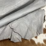 SL-209GRY Gray Goat 2 | Avetco Leather Hides and Eva Foam The Goatskin-washed Leather Collection offers an exclusive range of leather that undergoes a special tanning process, resulting in a unique and irregular texture. The leather's shrunken grain creates a striking and dynamic appearance, while its distressed look adds to its appeal. The thickness of the leather adds to its durability and dependability. The collection features a variety of warm and distinct colors that make it ideal for creating timeless looks.