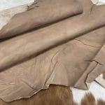 The Goatskin-washed Leather Collection offers an exclusive range of leather that undergoes a special tanning process, resulting in a unique and irregular texture. The leather's shrunken grain creates a striking and dynamic appearance, while its distressed look adds to its appeal. The thickness of the leather adds to its durability and dependability. The collection features a variety of warm and distinct colors that make it ideal for creating timeless looks.