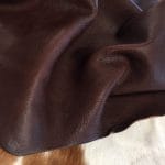 Introducing the Terrace collection VEG Tanned Leather, made from high-quality cowhide with a drum-dyed finish. This versatile style offers a smooth and consistent color that adds elegance and simplicity to any look. The surface of the leather features unique grooves and divots due to the whole-grain hide and its vegetal tannage.