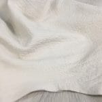 Bubble-shrunken Lambskin is a unique type of soft and cushiony lambskin with a shrunken bubble grain texture that gives it an intriguing and dynamic appearance. Each piece is one-of-a-kind due to the variation in the shrunken effect from one skin to another. The leather is semi-aniline dyed, making it rich and luxurious. It is also durable and flexible, with a thickness of 1.2-1.4 mm. Additionally, it is free from harmful chemicals, making it safe for use and environmentally friendly. If you're looking for high-quality and sustainable leather for apparel, accessories, handbags, or small leather goods, the Bubble Sheep collection is an excellent choice.