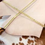 This premium 10/11 oz stamping leather is crafted from 100% natural veg-tanned cowhide using a meticulous drum process to ensure top-notch quality. All selections undergo the same rigorous treatment to guarantee exceptional rupture resistance, moisture protection, water penetration, and flexibility.