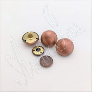 These rivets are an excellent choice for various applications, such as accessories, decorations, handbags, garments, leathercraft, and more. They add elegance and style to any project. However, it is essential to note that professional setting tools are required for installing these rivets. The rivets are designed to be easy to install and suitable for beginners and professionals. These rivets come in three plating options: brushed antique nickel, antique brass, and antique copper. They are made of high-quality alloy material, which is durable and long-lasting. They are also nickel-free and lead-free, making them safe for various applications. The available size for these rivets is 28.5mm (1.12") in diameter, with a post length of 7.5mm (0.30") and a cap size of 17.5mm (0.69") flat round. These dimensions make the rivets suitable for a variety of applications. These rivets are made in Hong Kong, ensuring they meet all relevant standards and are of the highest quality.
