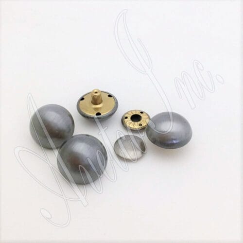 These rivets are an excellent choice for various applications, such as accessories, decorations, handbags, garments, leathercraft, and more. They add elegance and style to any project. However, it is essential to note that professional setting tools are required for installing these rivets. The rivets are designed to be easy to install and suitable for beginners and professionals. These rivets come in three plating options: brushed antique nickel, antique brass, and antique copper. They are made of high-quality alloy material, which is durable and long-lasting. They are also nickel-free and lead-free, making them safe for various applications. The available size for these rivets is 28.5mm (1.12") in diameter, with a post length of 7.5mm (0.30") and a cap size of 17.5mm (0.69") flat round. These dimensions make the rivets suitable for a variety of applications. These rivets are made in Hong Kong, ensuring they meet all relevant standards and are of the highest quality.