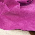 What is pig Leather Pig Leather collection - a range of leather products crafted from split suede material with a velvety texture. This leather is not only incredibly soft but also comes in a stunning array of colors that are sure to please any fashion enthusiast. The collection's versatile hues are perfect for creating a variety of atmospheres, from a dark and mystical ambiance to a pastel and dreamy feel. Whether you're looking to line a garment, create a handbag, or design footwear, this leather is sure to impress. With a whole hide ranging from 7-9 square feet and a thickness of 0.6-0.8 mm, you'll get to experience the beauty of a high-quality material that is both durable and stylish.
